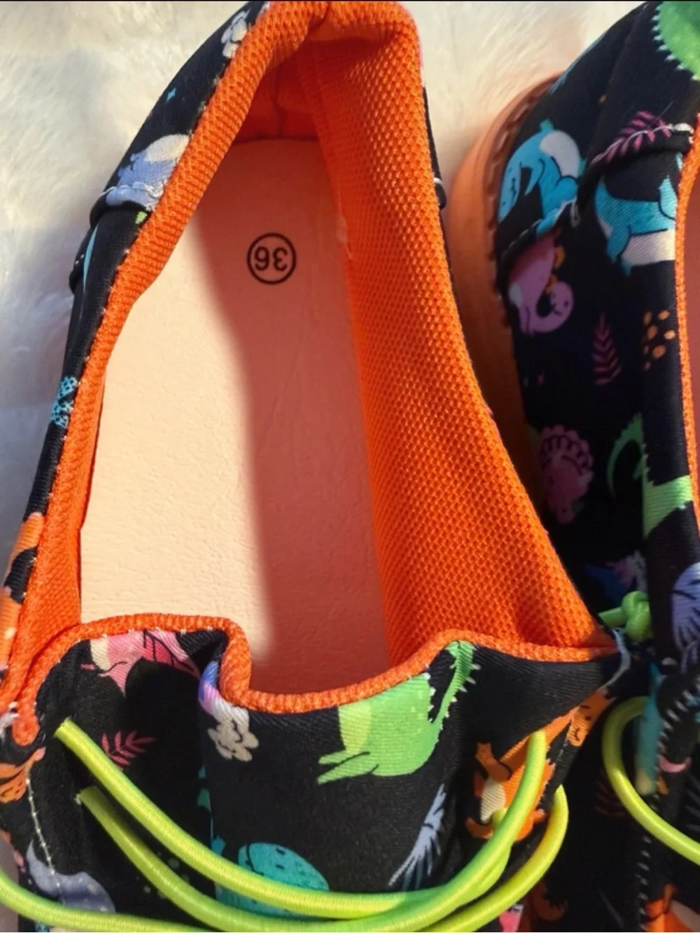 Kids Black Dinosaur Print Slip-On Shoes with Orange Sole